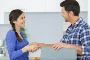 Customer and Kitchen fitter shaking hands